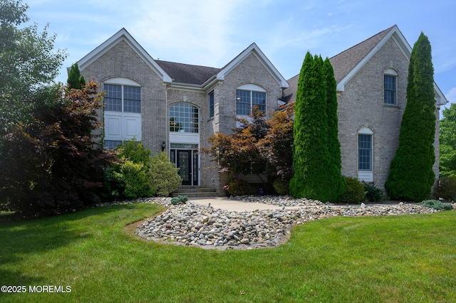 view of front of property with a front lawn