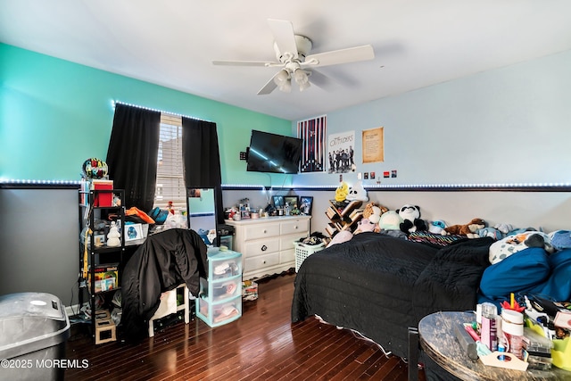 bedroom with ceiling fan and dark hardwood / wood-style flooring