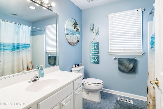 bathroom with vanity, tile patterned flooring, toilet, and a shower with shower curtain