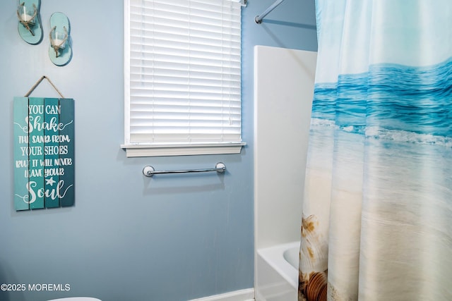 bathroom featuring shower / tub combo with curtain