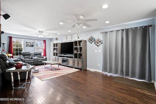 living room with dark hardwood / wood-style floors and ceiling fan