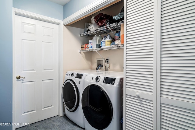 laundry area with tile patterned flooring and separate washer and dryer