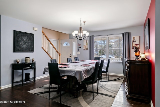 dining area featuring an inviting chandelier and dark hardwood / wood-style flooring