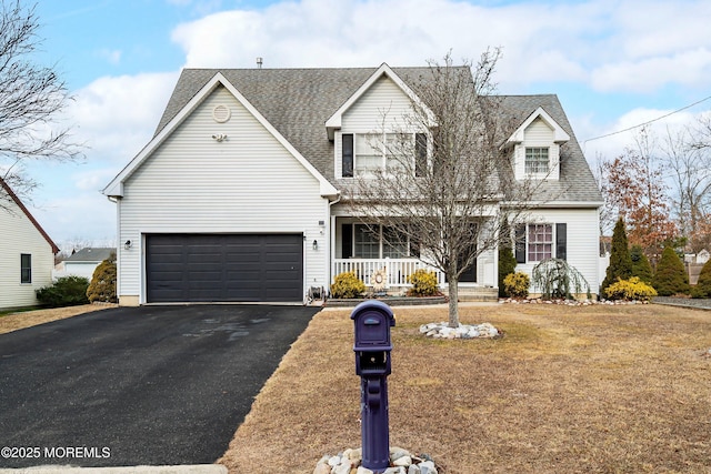 cape cod home featuring a front lawn and a porch