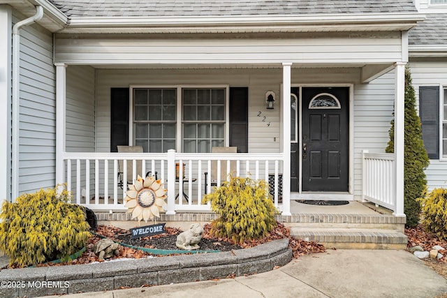 doorway to property featuring covered porch