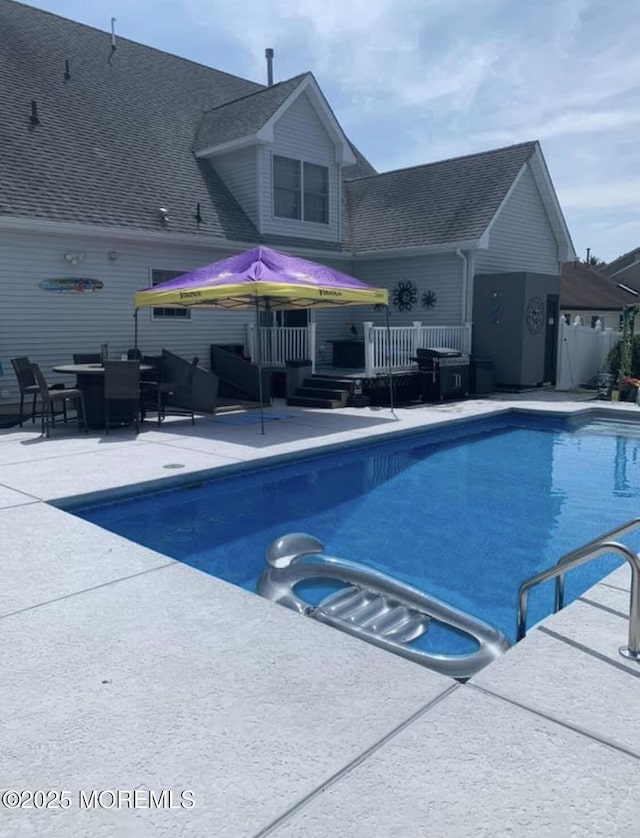 view of swimming pool with a patio area