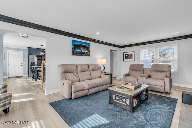 living room featuring hardwood / wood-style floors and ornamental molding