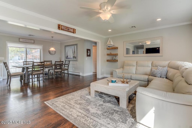 living room featuring ornamental molding, a baseboard heating unit, and dark hardwood / wood-style floors