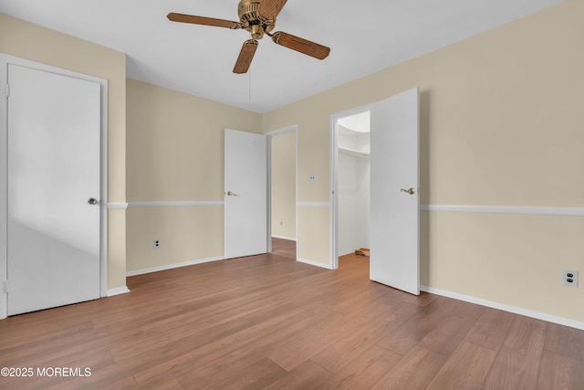 interior space with ceiling fan and light hardwood / wood-style floors