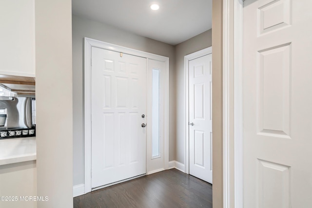 entrance foyer with dark hardwood / wood-style floors