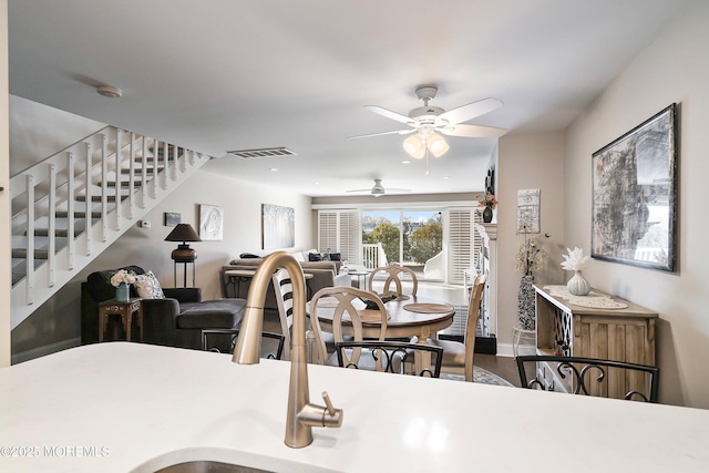 dining space with ceiling fan