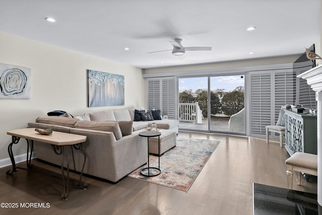 living room featuring hardwood / wood-style flooring and ceiling fan