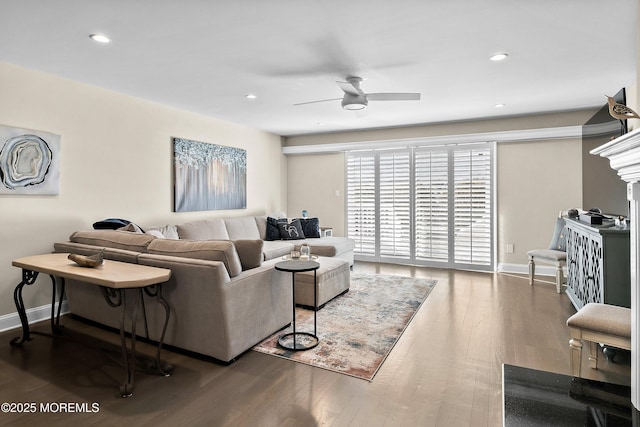 living room featuring hardwood / wood-style flooring and ceiling fan