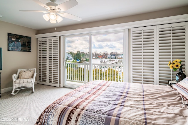 bedroom featuring multiple windows, access to exterior, ceiling fan, and carpet flooring