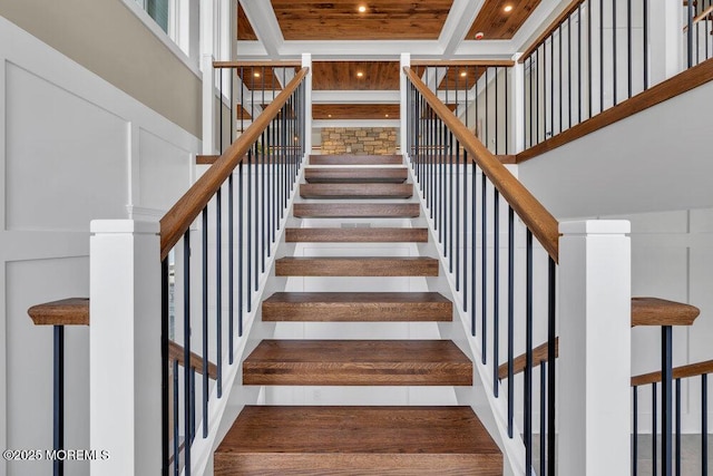 staircase with recessed lighting and a high ceiling