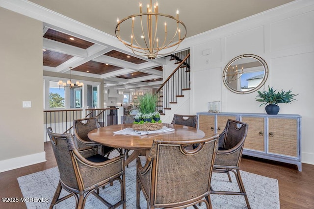 dining space featuring beamed ceiling, baseboards, stairway, a chandelier, and coffered ceiling