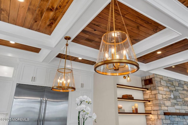 interior details with an inviting chandelier, built in refrigerator, wooden ceiling, and beam ceiling