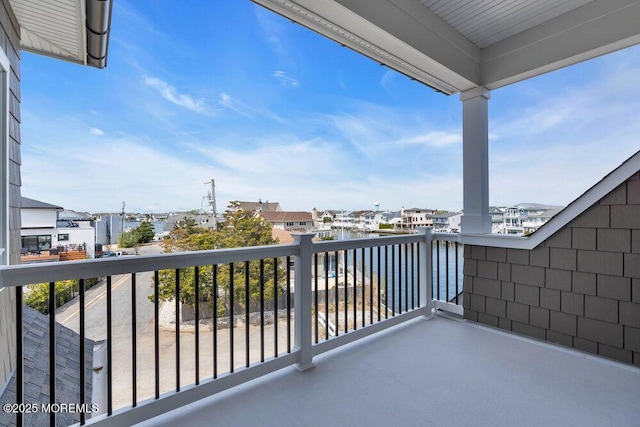 balcony featuring a water view