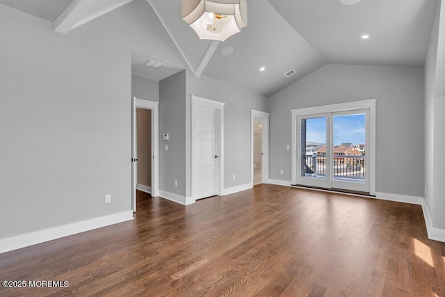 interior space with baseboards, visible vents, dark wood-style floors, and high vaulted ceiling