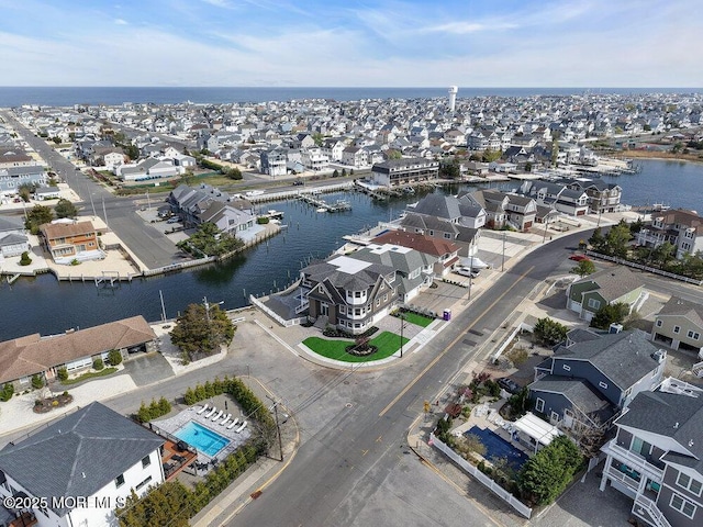 bird's eye view with a residential view and a water view