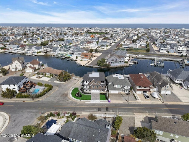 aerial view with a water view and a residential view