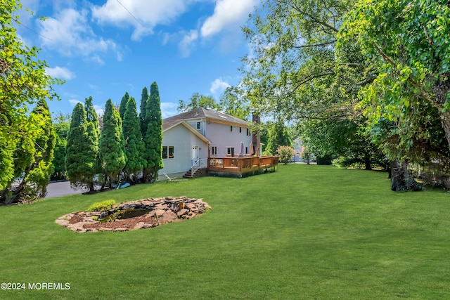 view of yard featuring a deck