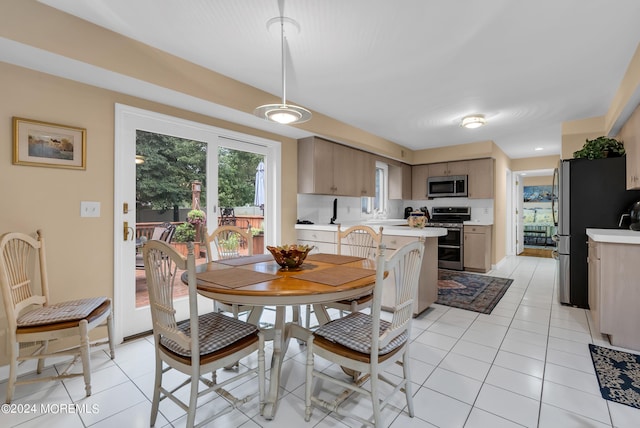 dining area with light tile patterned floors