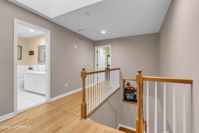 hall with light hardwood / wood-style flooring