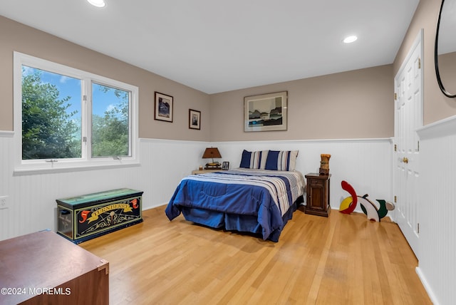 bedroom with hardwood / wood-style flooring