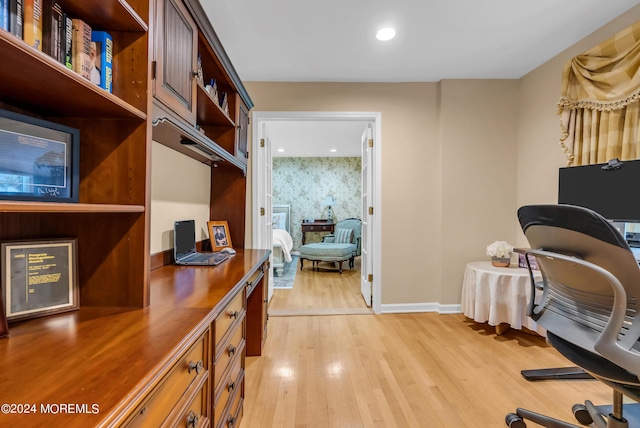 office with light hardwood / wood-style flooring