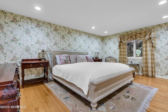 bedroom with hardwood / wood-style floors