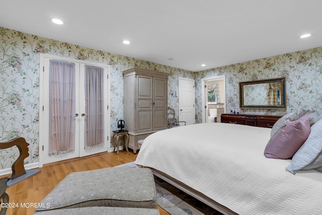 bedroom featuring french doors, light hardwood / wood-style floors, and access to outside