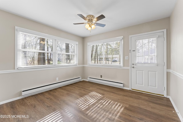 interior space with ceiling fan, a baseboard radiator, and dark hardwood / wood-style floors