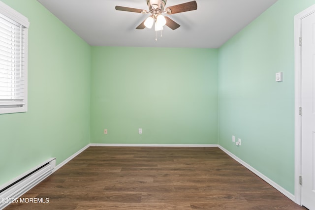 spare room featuring dark hardwood / wood-style floors, ceiling fan, and baseboard heating