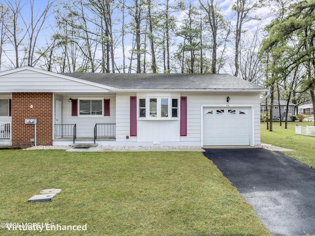 single story home featuring a garage and a front yard