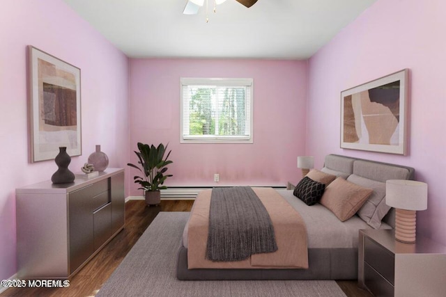 bedroom featuring a baseboard radiator and dark hardwood / wood-style flooring