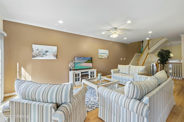 living room featuring ceiling fan and light wood-type flooring