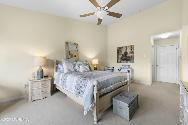 bedroom featuring light colored carpet and ceiling fan