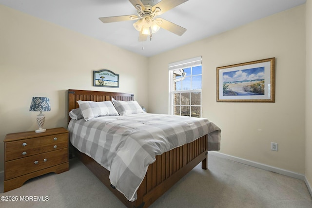 bedroom featuring light colored carpet and ceiling fan