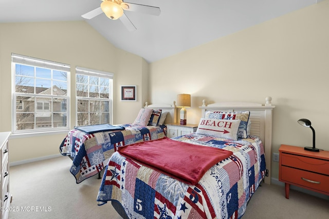 carpeted bedroom featuring lofted ceiling and ceiling fan