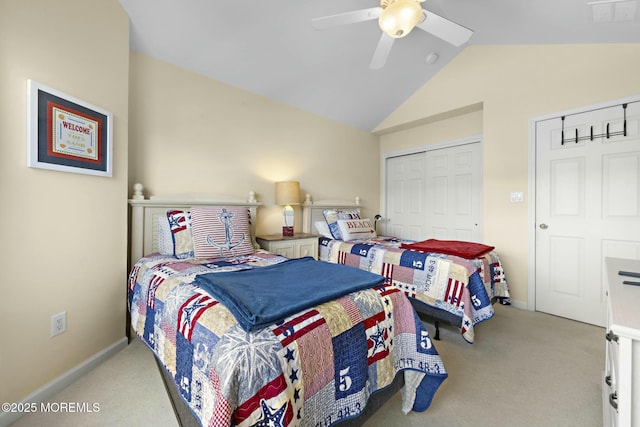 bedroom featuring lofted ceiling, light colored carpet, ceiling fan, and a closet