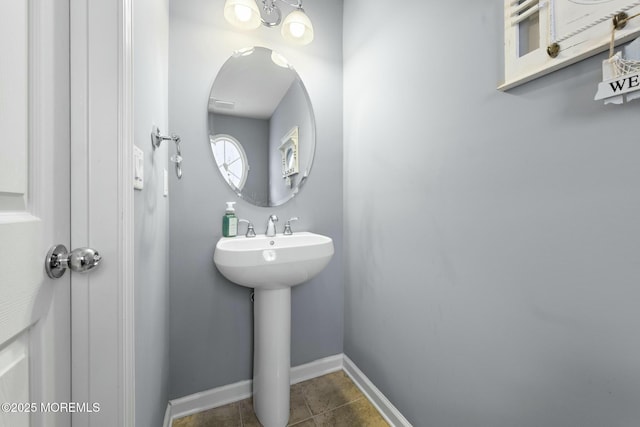 bathroom with tile patterned floors