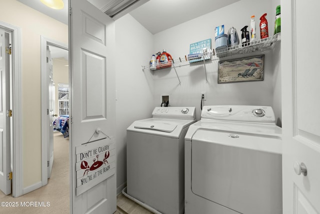 laundry area with independent washer and dryer