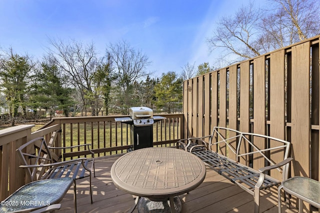 wooden deck featuring area for grilling