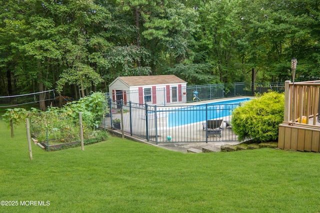 view of pool with an outdoor structure and a lawn