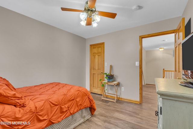 bedroom featuring light hardwood / wood-style floors and ceiling fan