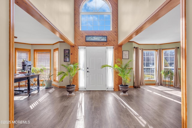 entrance foyer featuring crown molding and hardwood / wood-style floors