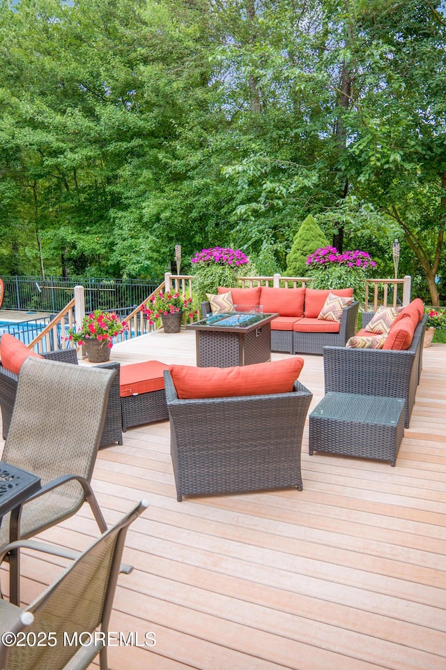 deck featuring outdoor lounge area