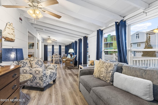 bedroom featuring lofted ceiling with beams, ceiling fan, and light wood-type flooring