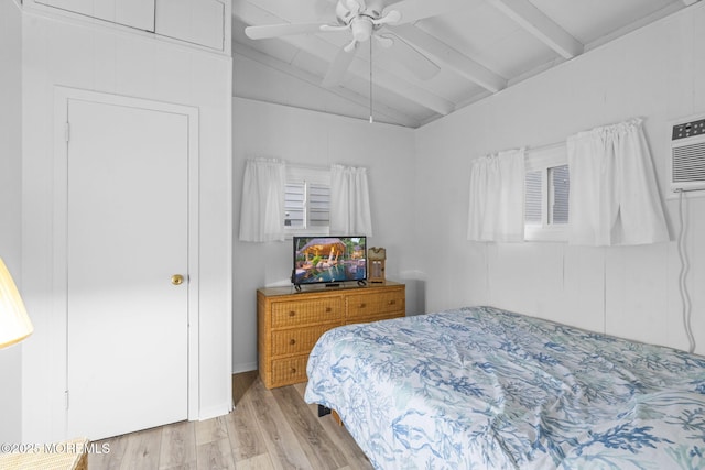 bedroom featuring ceiling fan, lofted ceiling with beams, and light wood-type flooring